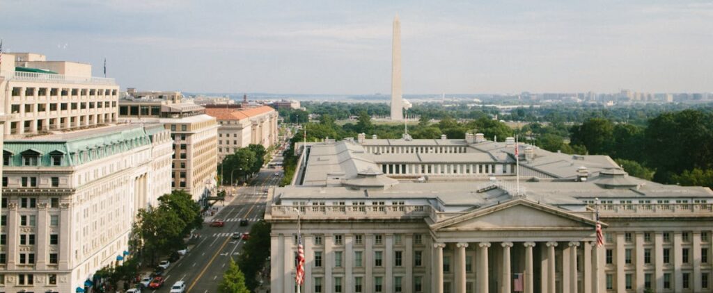 Breathtaking aerial view of the Washington Monument and surrounding architecture on a sunny day in Washington, D.C.